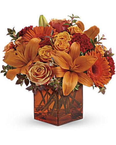 <div id="mark-3" class="m-pdp-tabs-marketing-description">Celebrate the wonder of a new day with warm, golden flowers. A modern orange glass vase is the foundation of this stunning, sun-bright bouquet that energizes any occasion.</div>
<del> </del>
<ul>
<li>Orange gerbera daisies, orange roses and red mini carnations are accented with a spray of red huckleberry in an orange cube</li>
</ul>
<div id="desc-3">
<ul>
<li>vase.</li>
</ul>
</div>
<ul>
<li></li>
</ul>